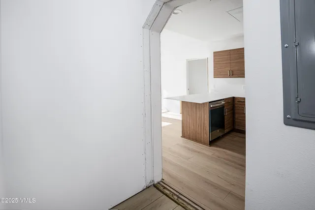 a view of kitchen with wooden floor