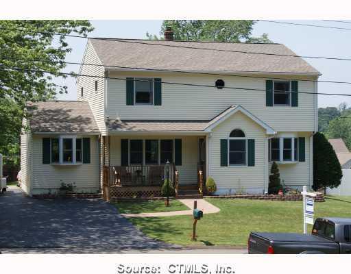 147 Borrmann Road East Haven, CT 06512 - Photo 1 of 1 a view of a white house with large windows and yard