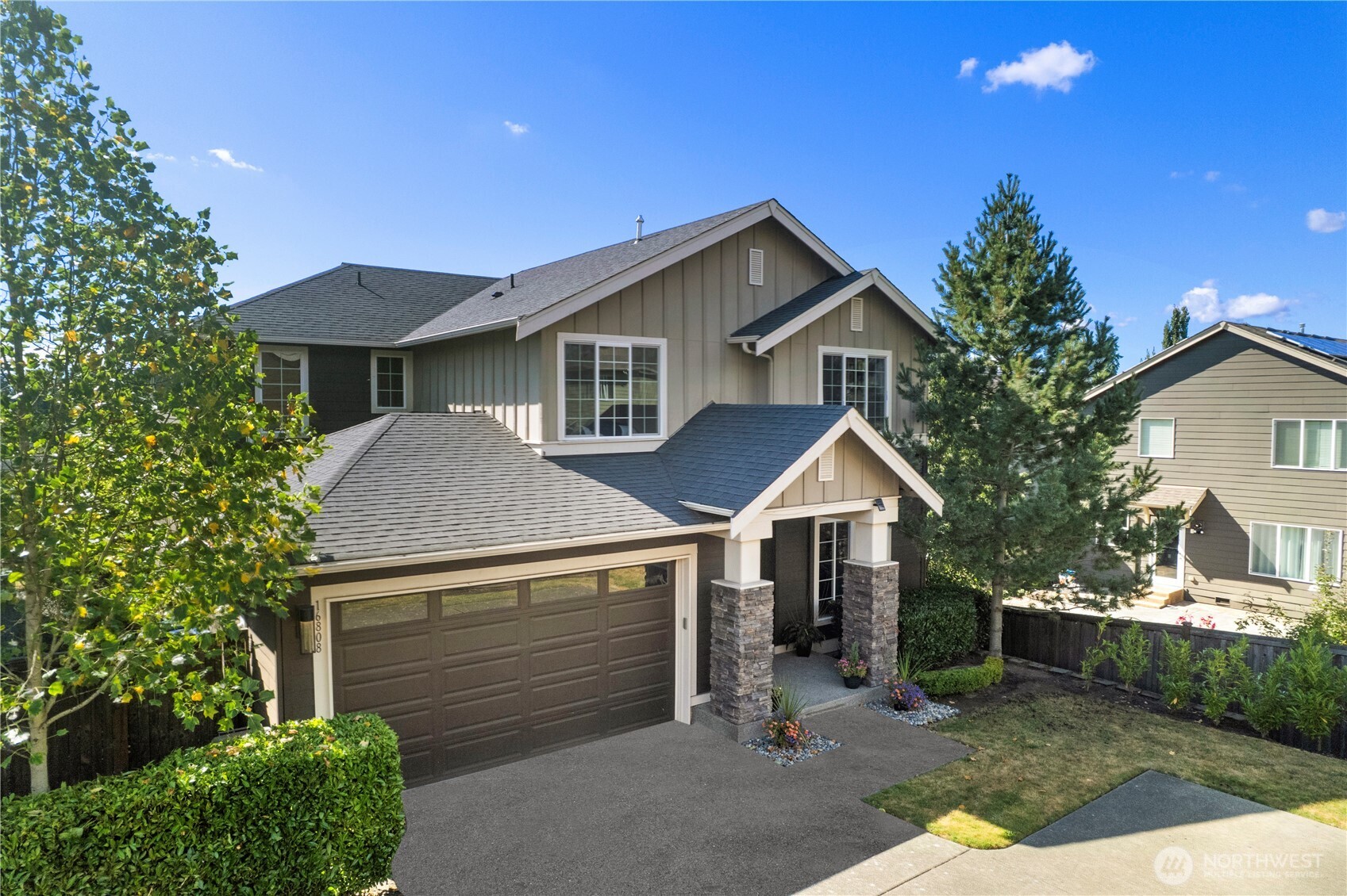 16808 42nd Drive Southeast Bothell, WA 98012 - Photo 1 of 23 a front view of a house with garden