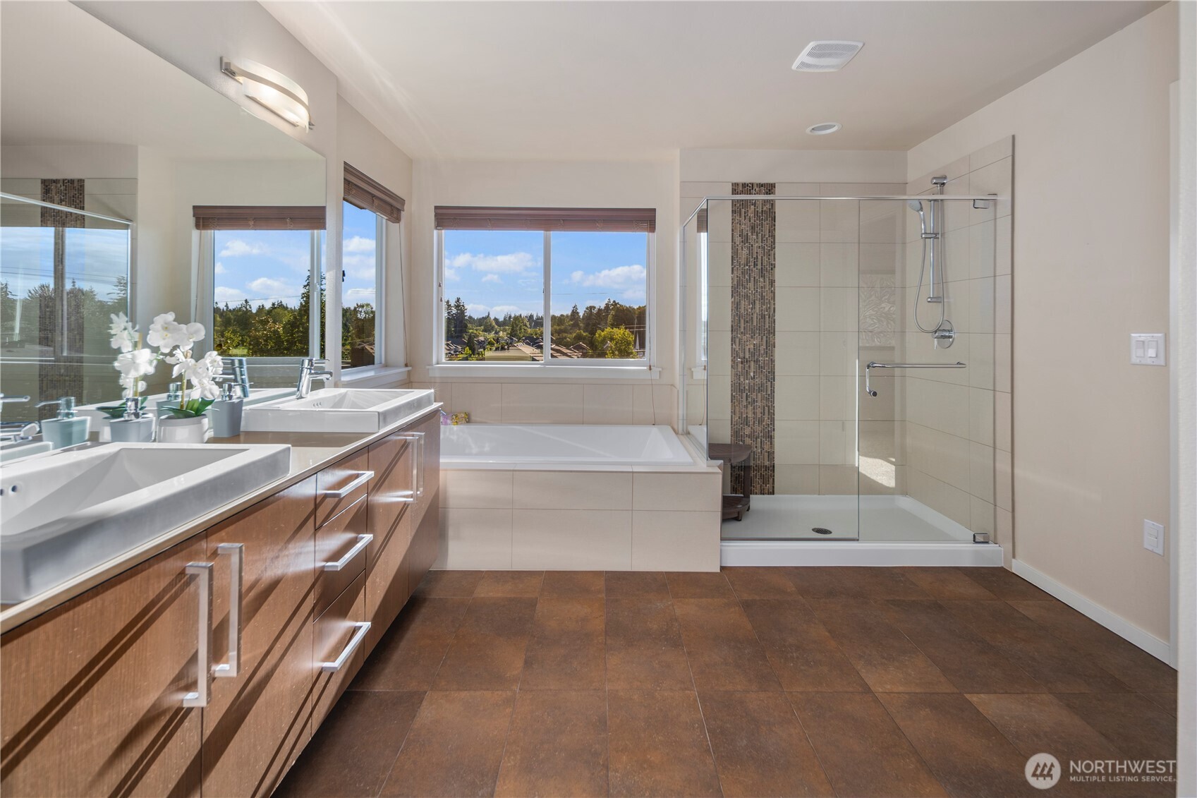 16808 42nd Drive Southeast Bothell, WA 98012 - Photo 14 of 23 a spacious bathroom with a double vanity sink a mirror and a bathtub