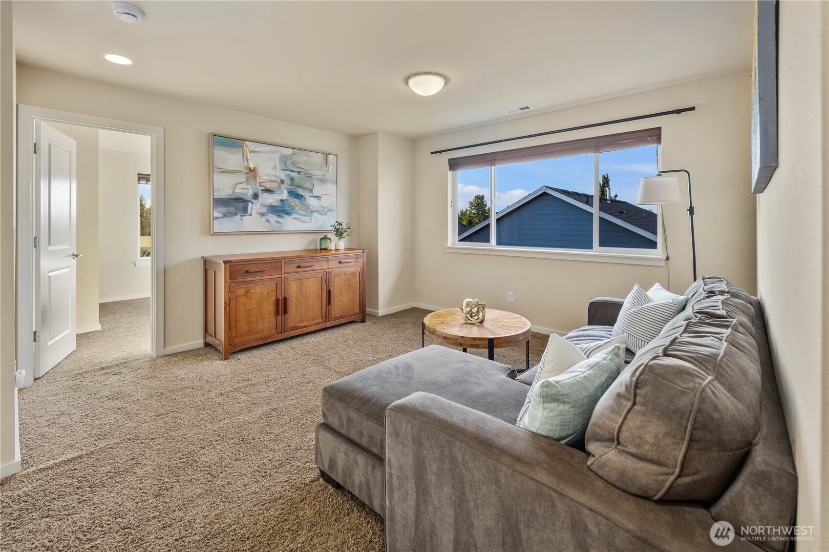 16808 42nd Drive Southeast Bothell, WA 98012 - Photo 16 of 23 a living room with furniture and a flat screen tv
