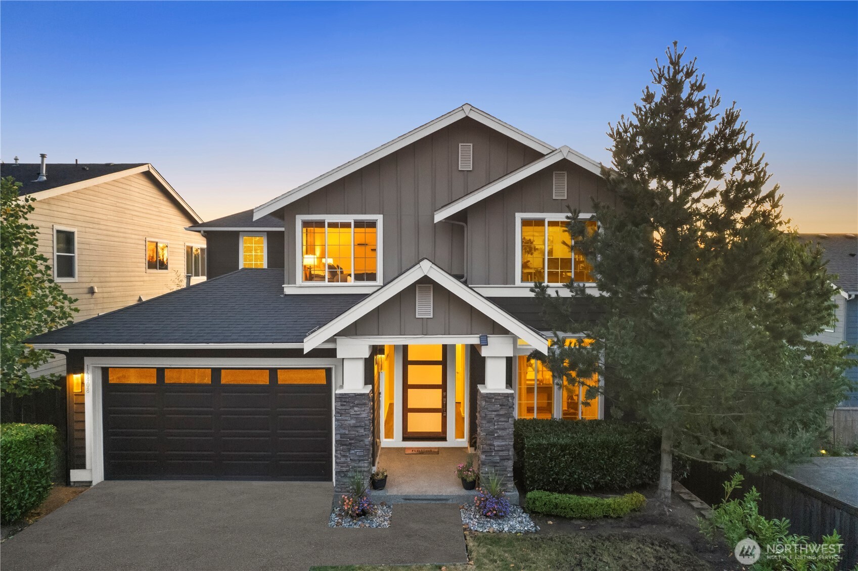 16808 42nd Drive Southeast Bothell, WA 98012 - Photo 2 of 23 a front view of a house with yard and garage