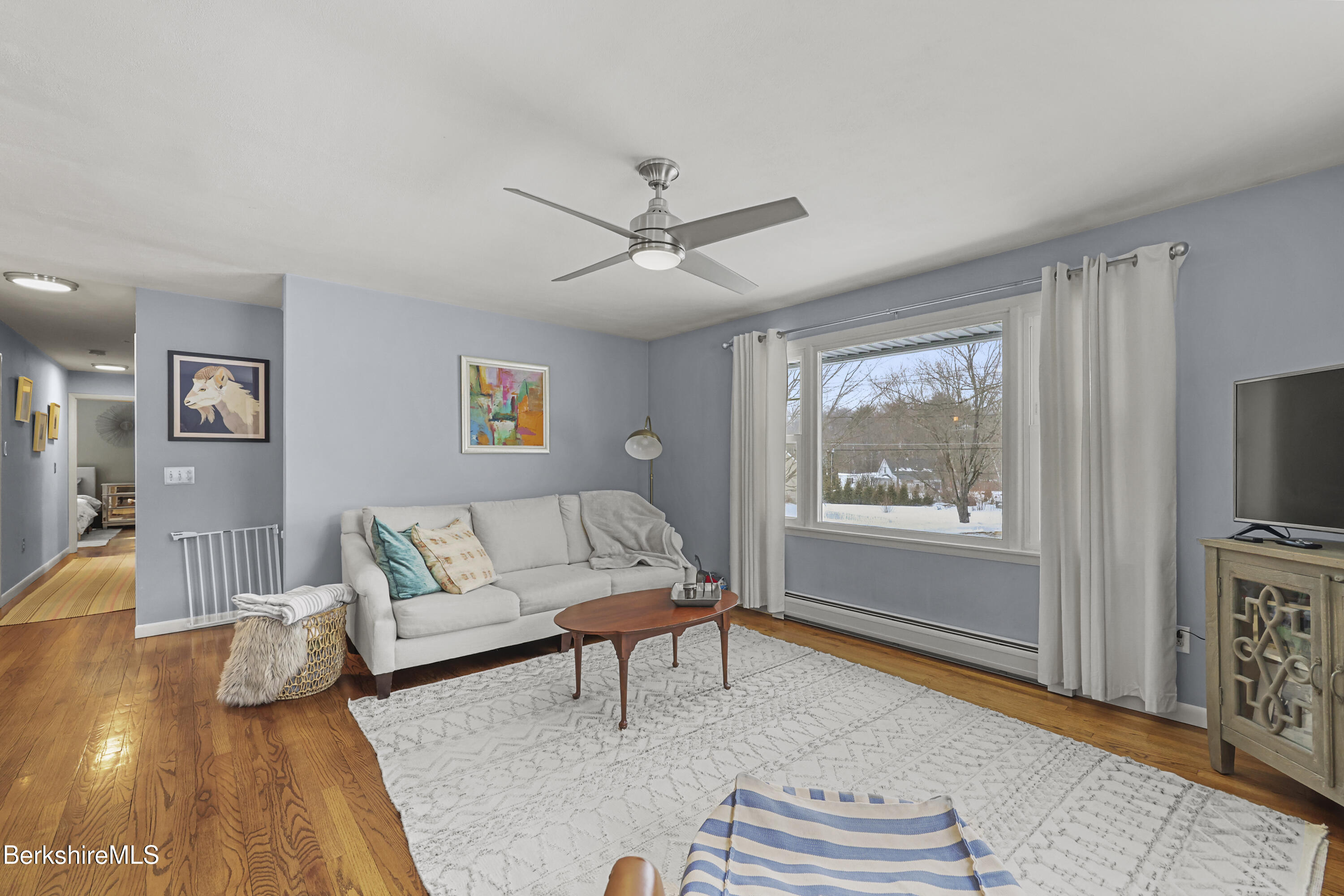 184 Washington Mountain Road Lee, MA 01238 - Photo 10 of 42 a living room with furniture and a flat screen tv