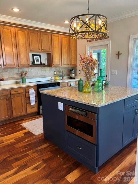 183 Burl Bridges Road Forest City, NC 28043 - Photo 21 of 31 a kitchen with stainless steel appliances granite countertop a stove a sink and a microwave