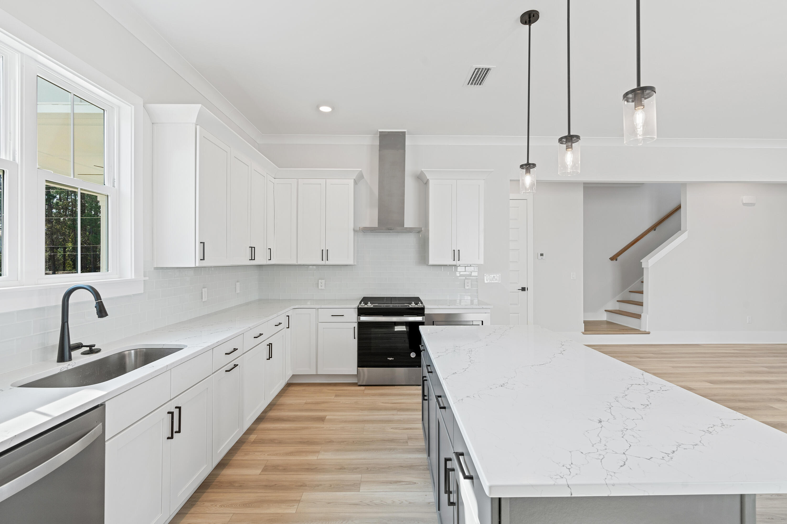 40 Mckenna Way Santa Rosa Beach, FL 32459 - Photo 27 of 61 a kitchen with granite countertop a sink a counter space appliances and cabinets