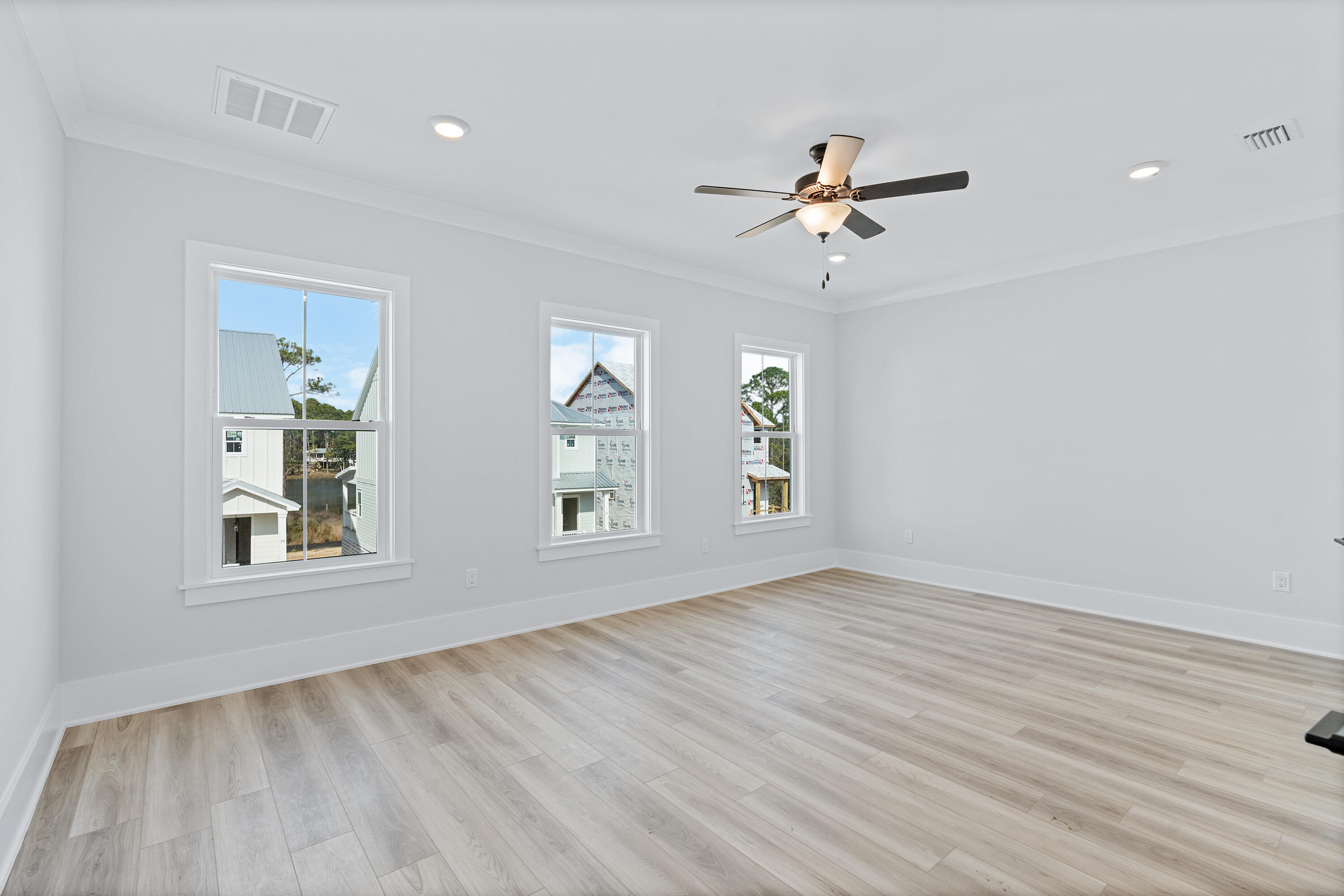 40 Mckenna Way Santa Rosa Beach, FL 32459 - Photo 38 of 61 wooden floor in an empty room with a window