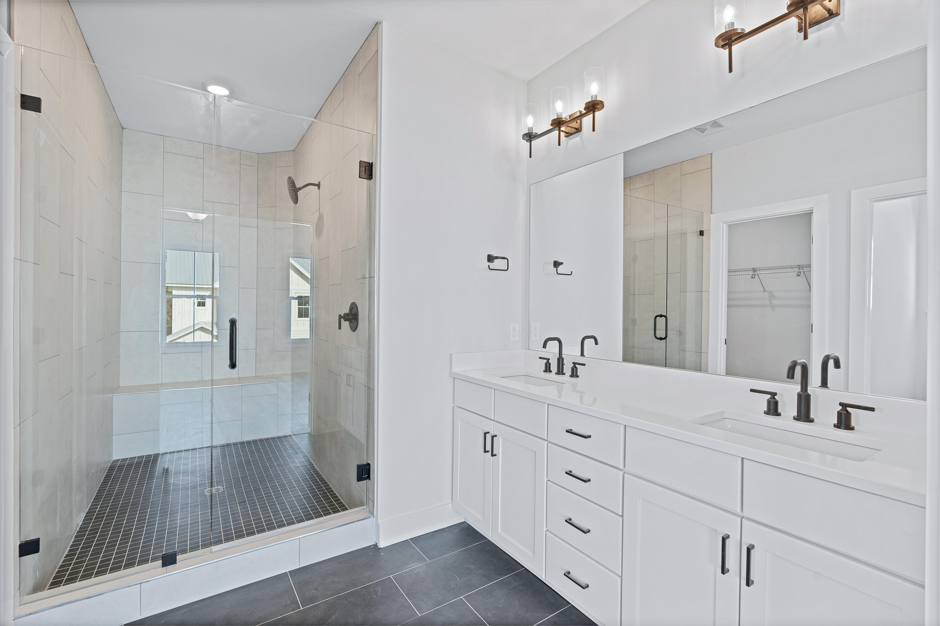 40 Mckenna Way Santa Rosa Beach, FL 32459 - Photo 41 of 61 a spacious bathroom with a shower sink and mirror