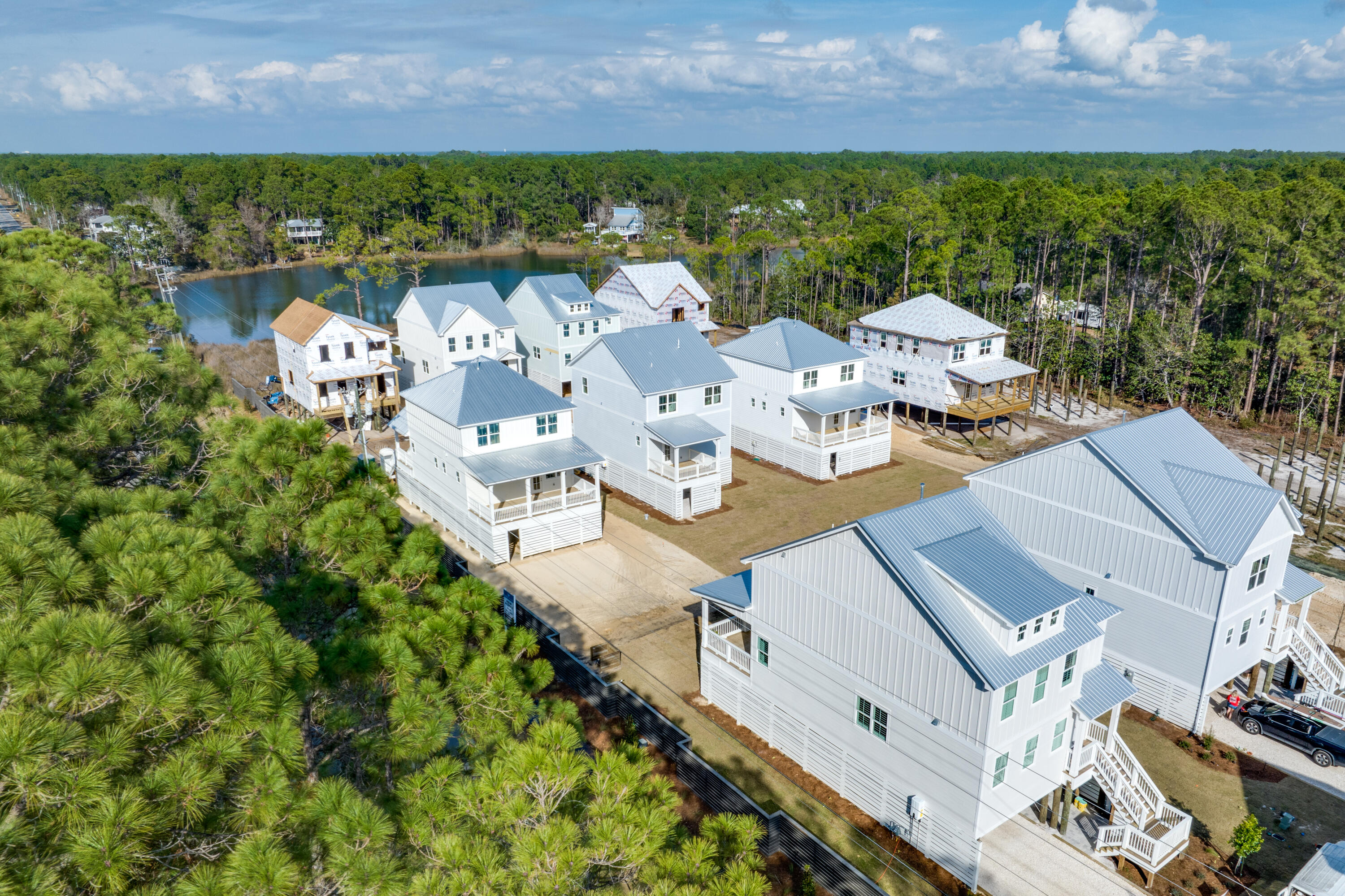 40 Mckenna Way Santa Rosa Beach, FL 32459 - Photo 4 of 61 an aerial view of a house with garden space and outdoor seating