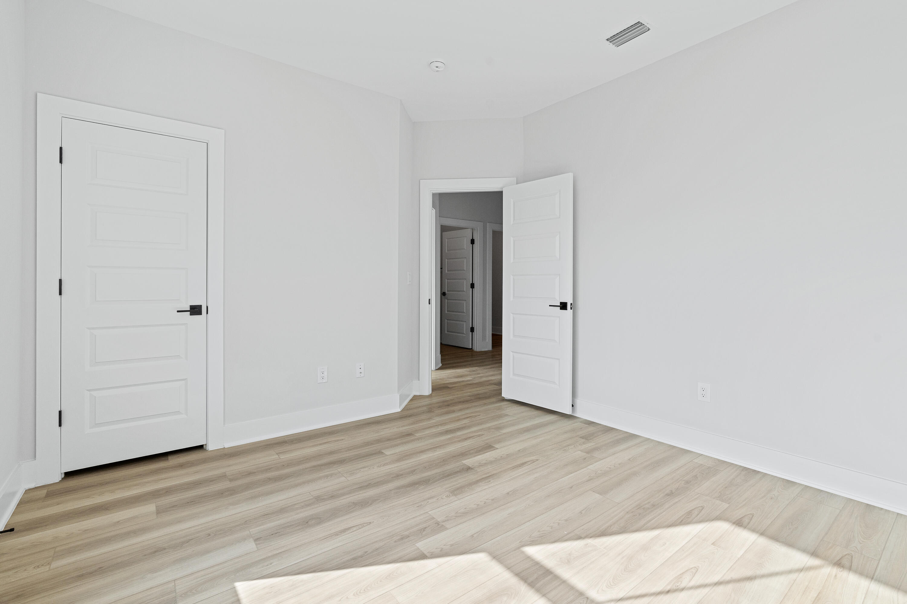40 Mckenna Way Santa Rosa Beach, FL 32459 - Photo 50 of 61 an empty room with wooden floor and closet