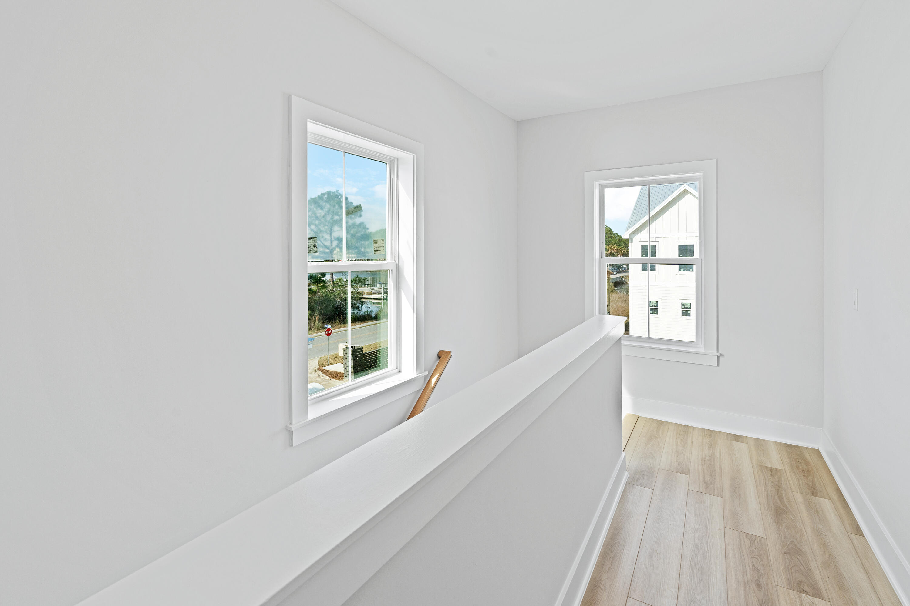 40 Mckenna Way Santa Rosa Beach, FL 32459 - Photo 51 of 61 a view of an empty room with wooden floor and a window