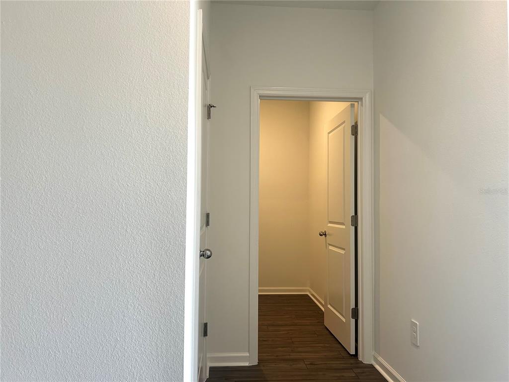 4693 Southwest 83rd Loop Ocala, FL 34476 - Photo 13 of 25 a view of room with wooden floor