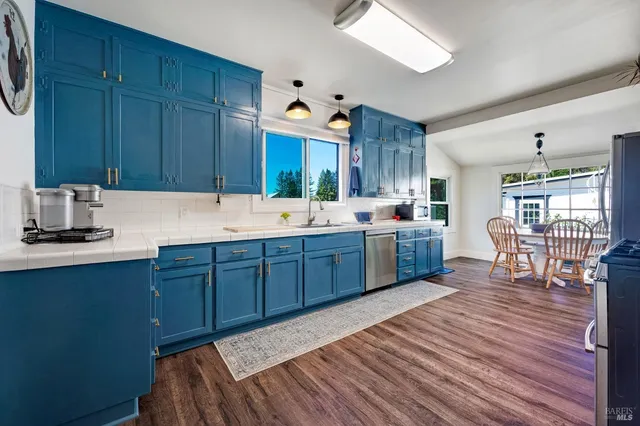 a bathroom with a sink mirror and vanity