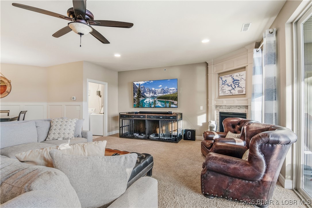 3168 Twin Rivers Point, Unit 2E Camdenton, MO 65020 - Photo 13 of 52 The living room is cozy and well lit by the lakesi