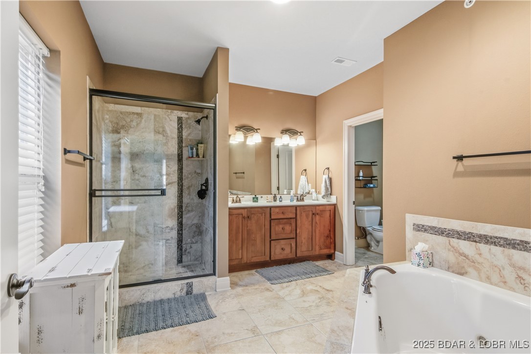 3168 Twin Rivers Point, Unit 2E Camdenton, MO 65020 - Photo 17 of 52 Step into your spacious primary bath complete with