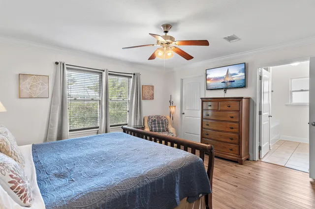 a bedroom with furniture and window