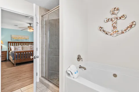 a bathroom with a bathtub and a shower