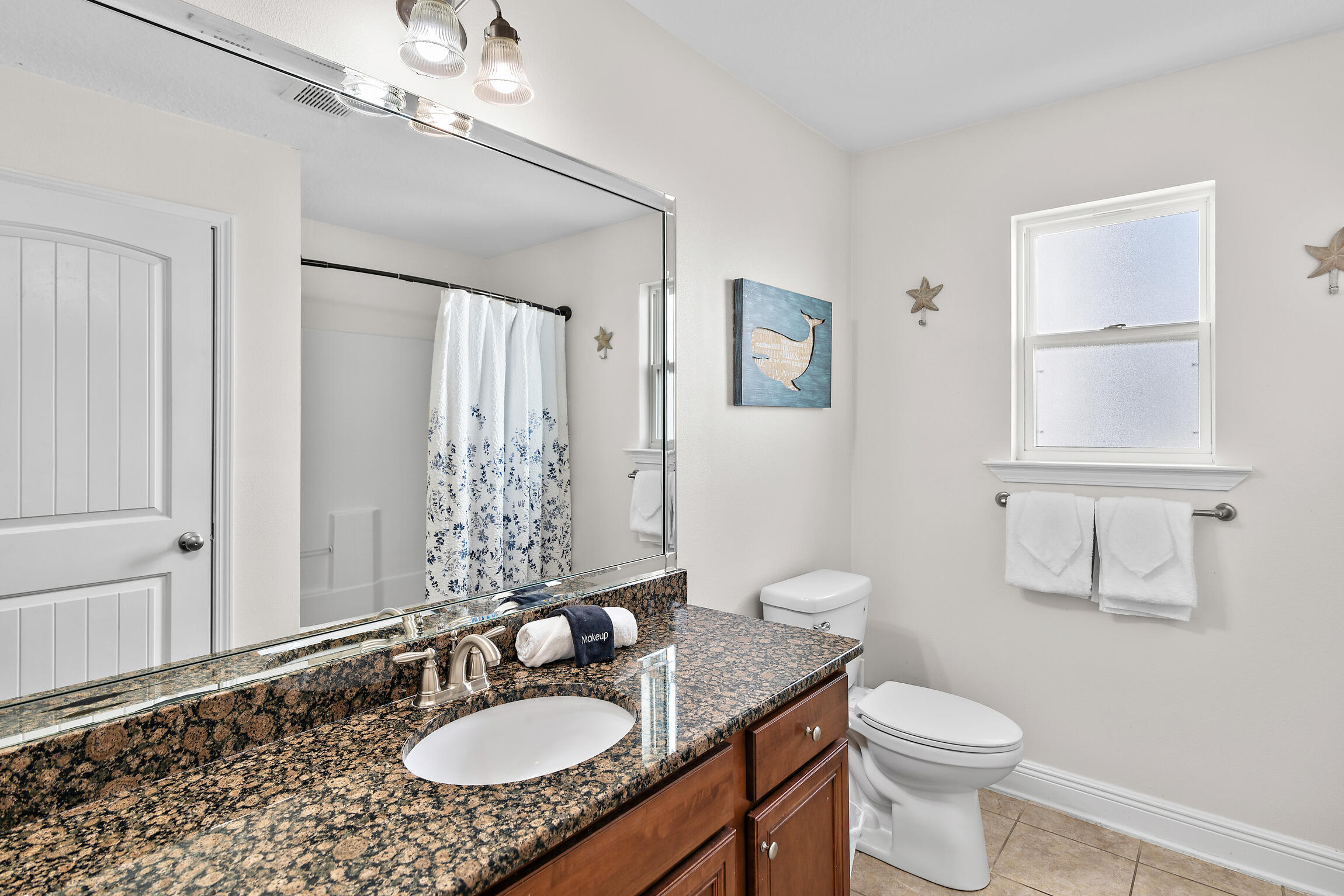 19 Charming Way Santa Rosa Beach, FL 32459 - Photo 28 of 52 a bathroom with a granite countertop sink toilet a mirror and shower