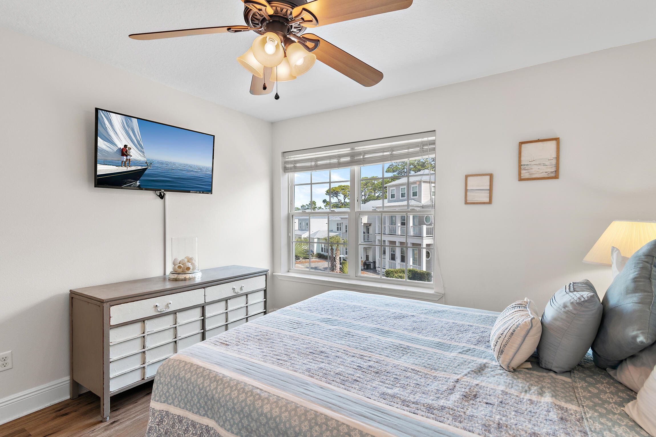 19 Charming Way Santa Rosa Beach, FL 32459 - Photo 30 of 52 a bedroom with a bed and a chandelier