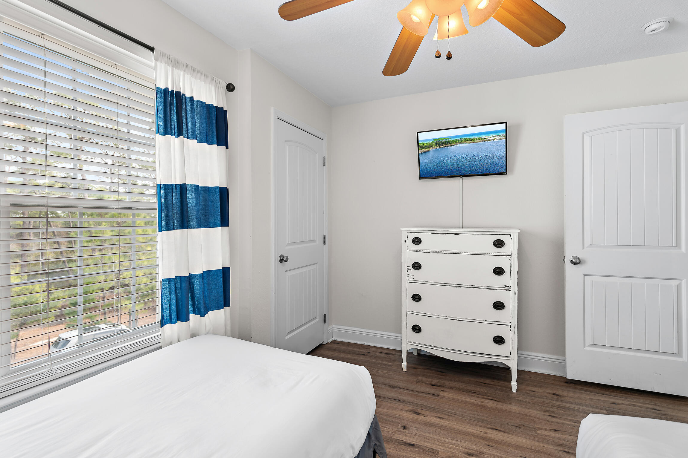 19 Charming Way Santa Rosa Beach, FL 32459 - Photo 32 of 52 a bedroom with a bed and wooden floor