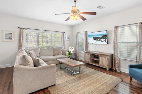 a living room with furniture and a flat screen tv