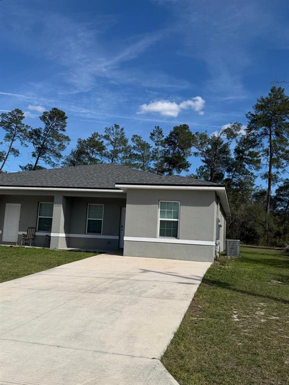 16265 Southwest 29th Court Road Ocala, FL 34473 - Photo 2 of 8 front view of house with a yard