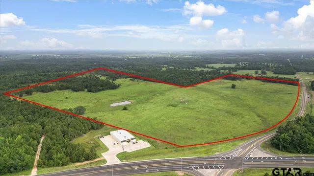 a view of a swimming pool with a yard