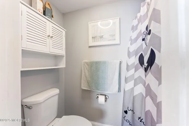 a bathroom with a toilet and a sink