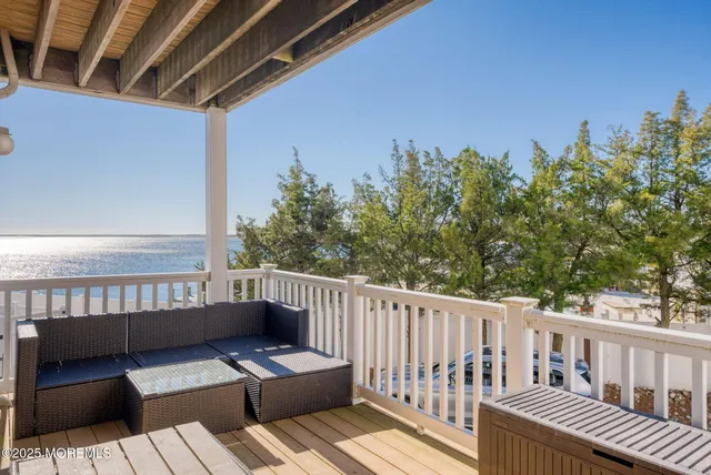 a view of a balcony with furniture