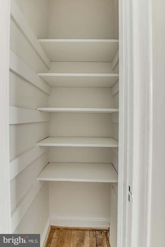 3311 Commonwealth Avenue, Unit E Alexandria, VA 22305 - Photo 24 of 31 a view of a store room with shelves