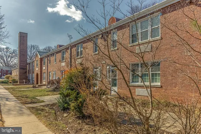 a building with trees in front of it