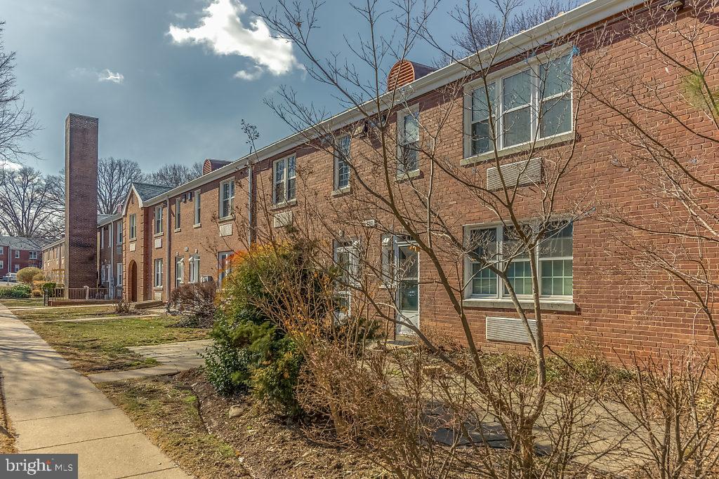3311 Commonwealth Avenue, Unit E Alexandria, VA 22305 - Photo 27 of 31 a building with trees in front of it