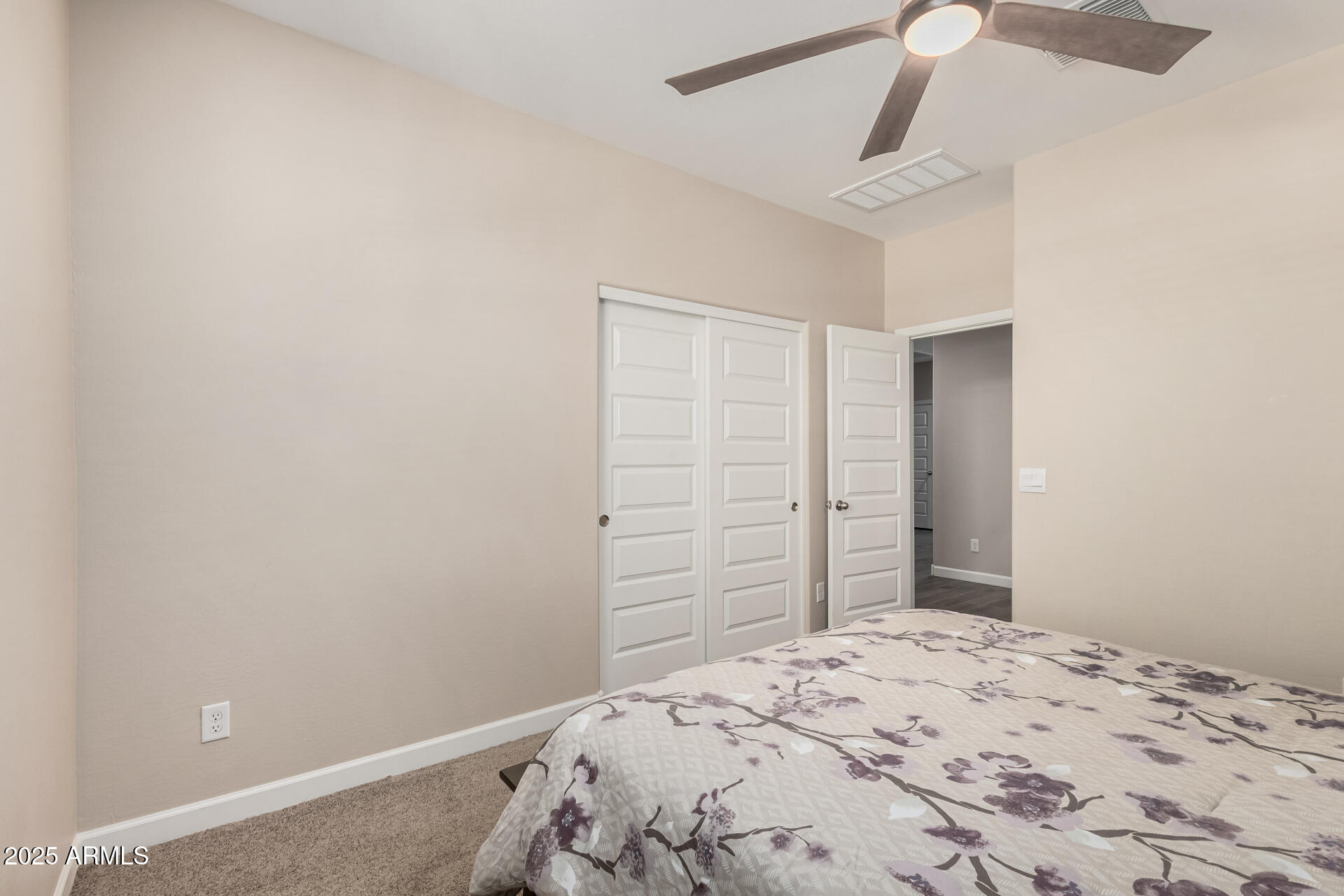 2475 West Spaulding Avenue Apache Junction, AZ 85120 - Photo 26 of 58 a bedroom with a bed and cabinets