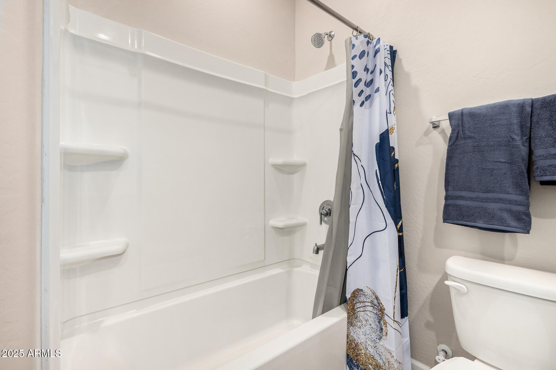 2475 West Spaulding Avenue Apache Junction, AZ 85120 - Photo 32 of 58 a white bath tub sitting next to a white toilet