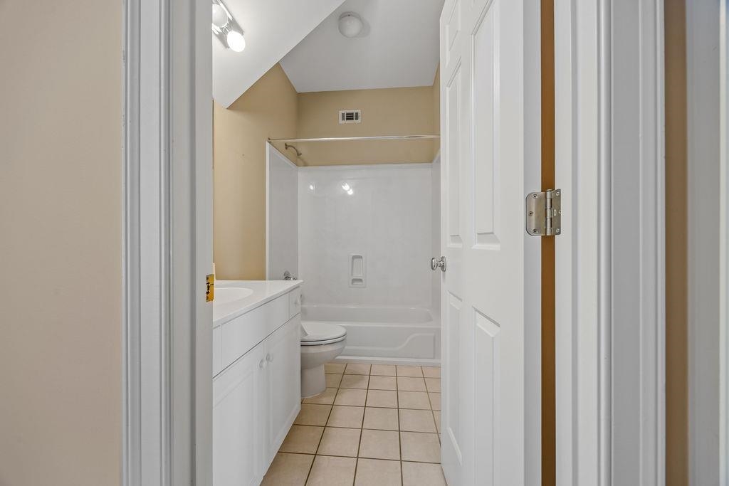 8009 Fox Fern Road Germantown, TN 38138 - Photo 15 of 40 a bathroom with a granite countertop sink mirror and a toilet