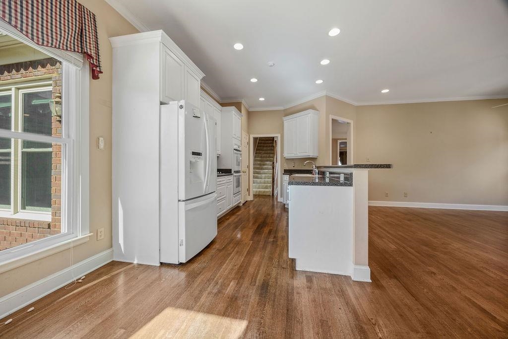 8009 Fox Fern Road Germantown, TN 38138 - Photo 18 of 40 a view of kitchen with stainless steel appliances refrigerator stove microwave and cabinets