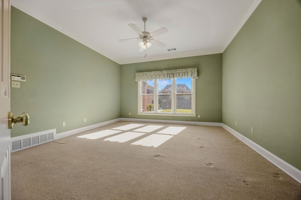 8009 Fox Fern Road Germantown, TN 38138 - Photo 29 of 40 an empty room with windows and ceiling fan