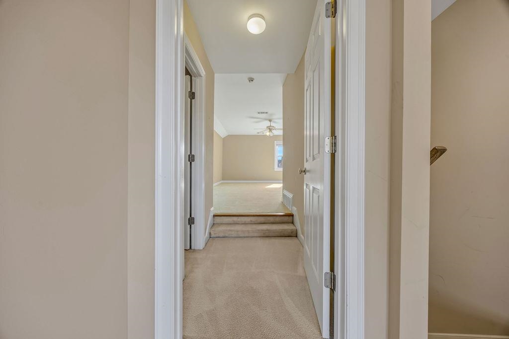 8009 Fox Fern Road Germantown, TN 38138 - Photo 40 of 40 a view of a hallway with a livingroom and a bathroom with sink