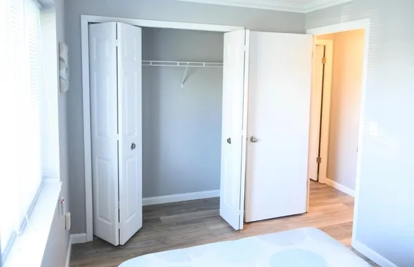 a view of a bathroom with wooden floor