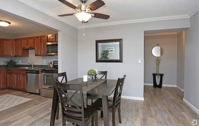 a view of a dining room with furniture and wooden floor