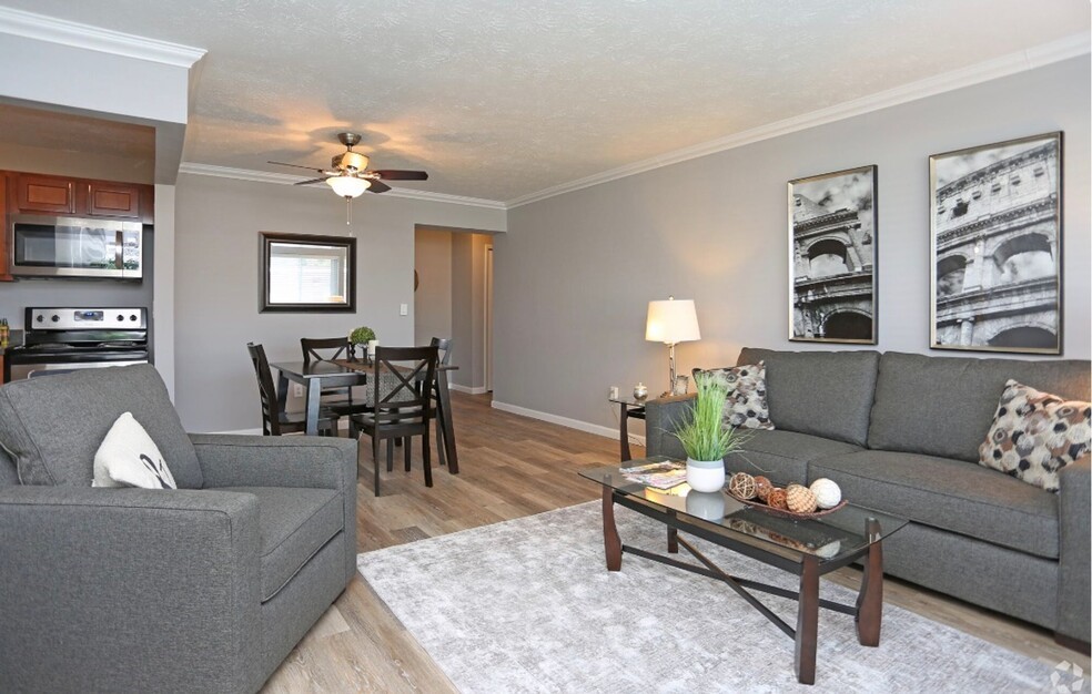 101 Lafayette Road Syracuse, NY 13205 - Photo 18 of 25 a living room with furniture a chandelier and a window