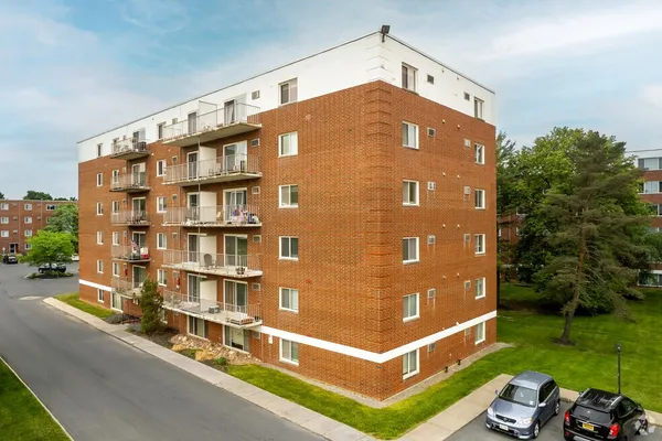 a front view of a building with garden