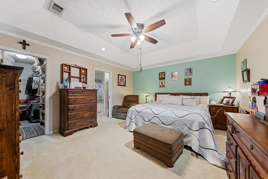 370 Evergreen Drive Fortson, GA 31808 - Photo 13 of 32 a bed room with a bed and a ceiling fan