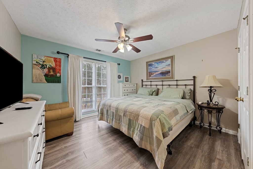 370 Evergreen Drive Fortson, GA 31808 - Photo 18 of 32 a bedroom with a bed couch and a window