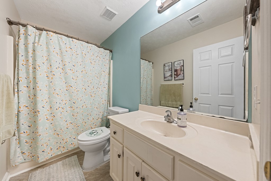 370 Evergreen Drive Fortson, GA 31808 - Photo 20 of 32 a bathroom with a sink toilet and shower