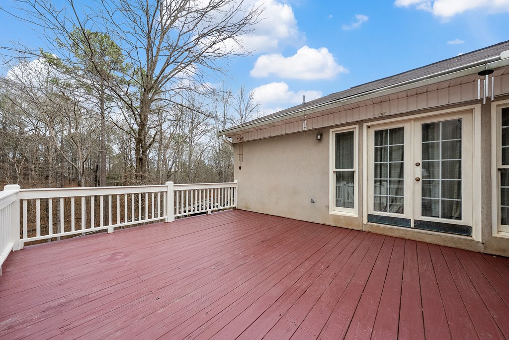 370 Evergreen Drive Fortson, GA 31808 - Photo 29 of 32 a view of a deck with wooden floor and fence