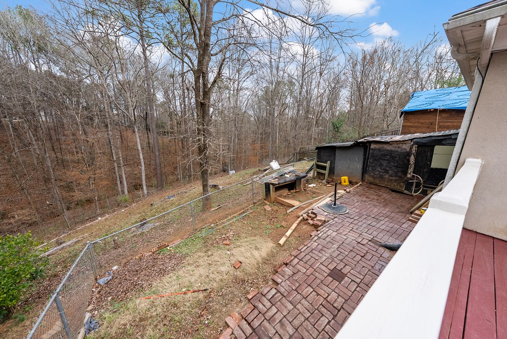 370 Evergreen Drive Fortson, GA 31808 - Photo 32 of 32 a backyard of a house with table and chairs