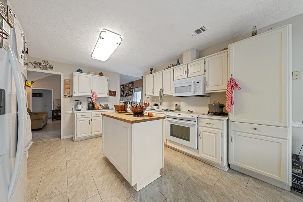 370 Evergreen Drive Fortson, GA 31808 - Photo 9 of 32 a kitchen with cabinets stainless steel appliances and a window