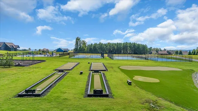 a outdoor living space with patio furniture and a fireplace