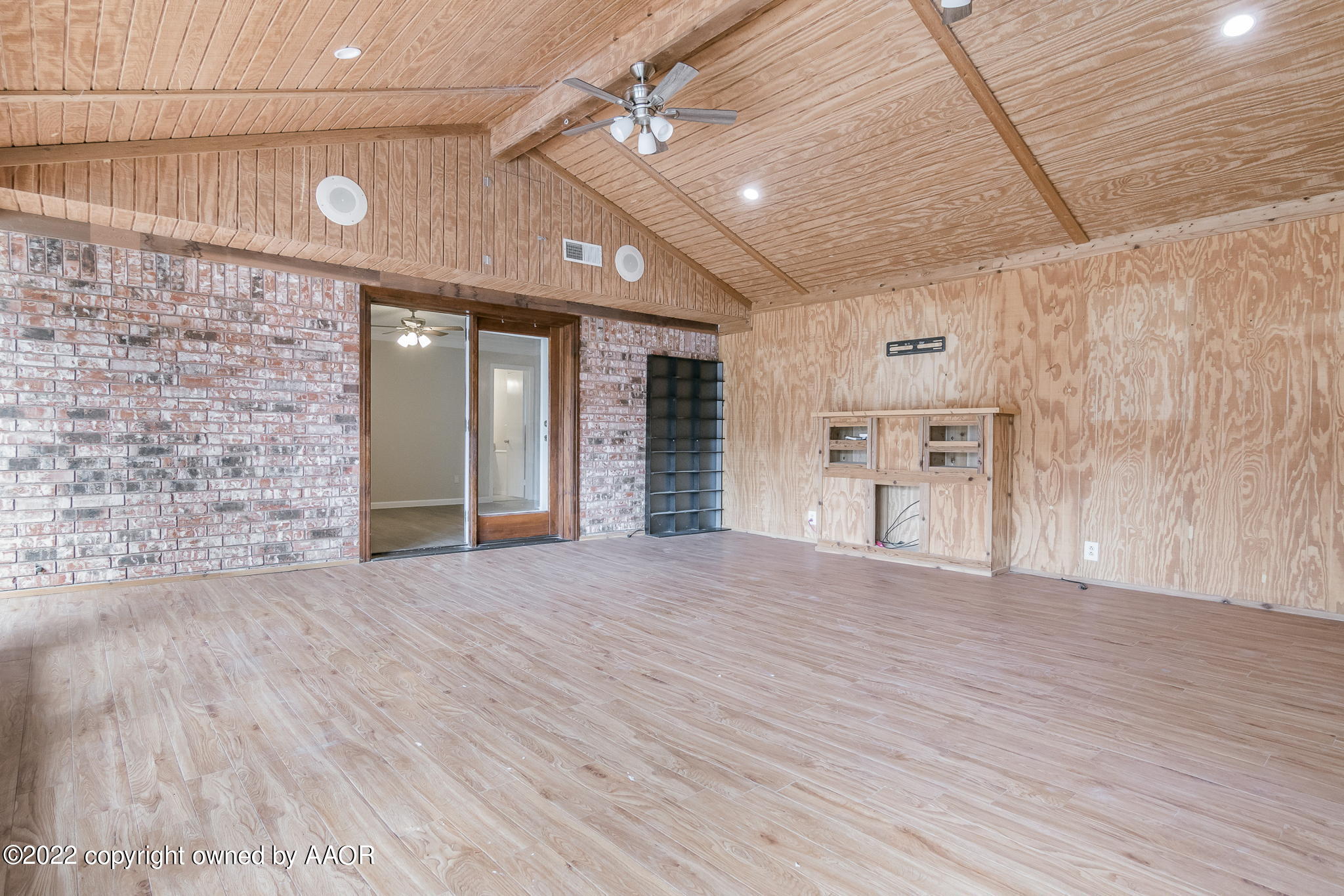 7720 Canode Drive Amarillo, TX 79121 - Photo 14 of 21 a view of empty room with wooden floor and fan