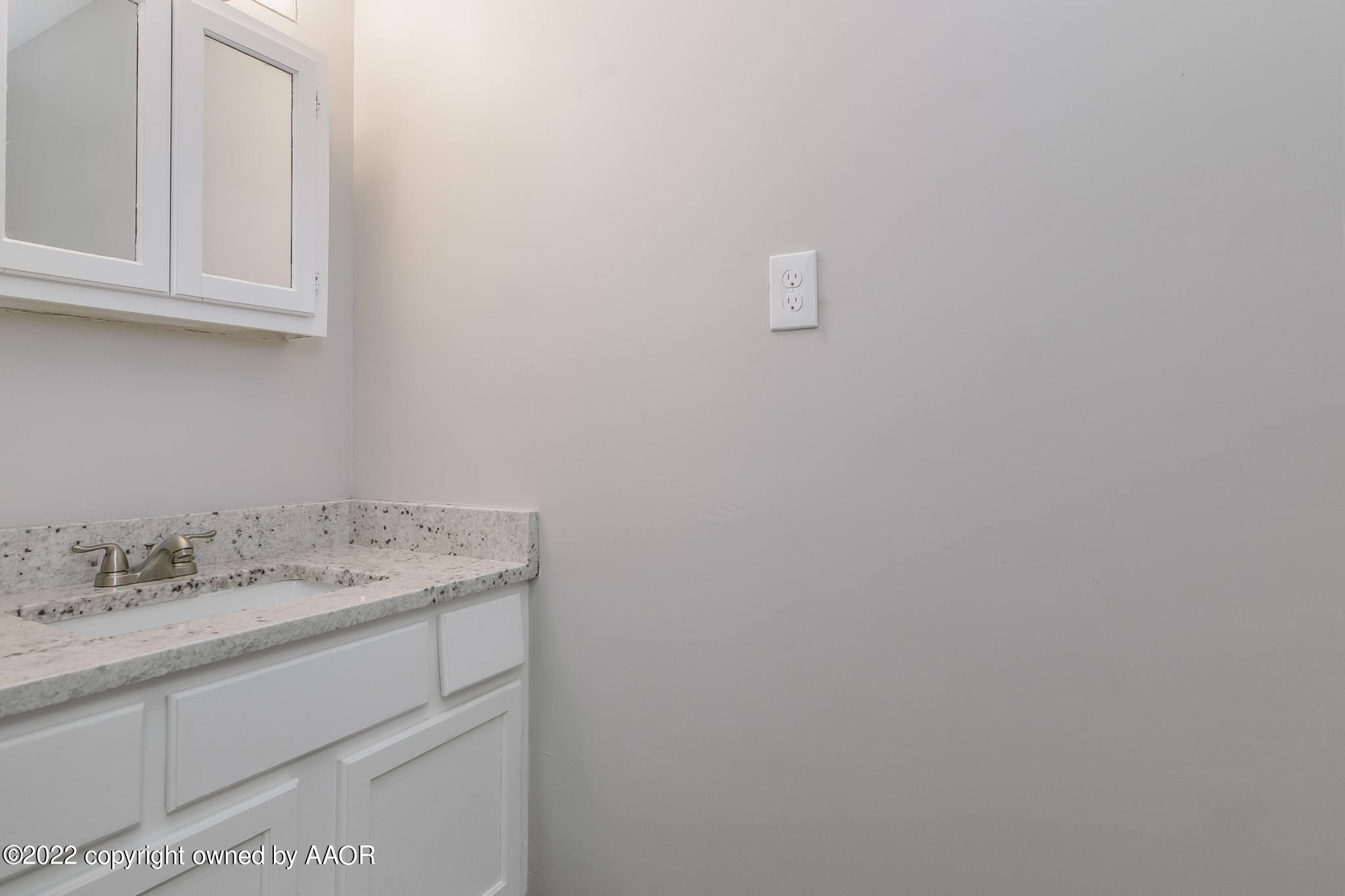 7720 Canode Drive Amarillo, TX 79121 - Photo 17 of 21 a bathroom with a sink and vanity